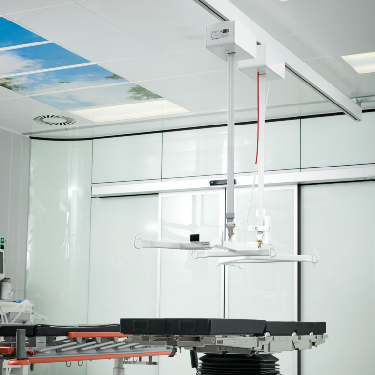 Effortless movement of unconscious patients using a ceiling hoist.