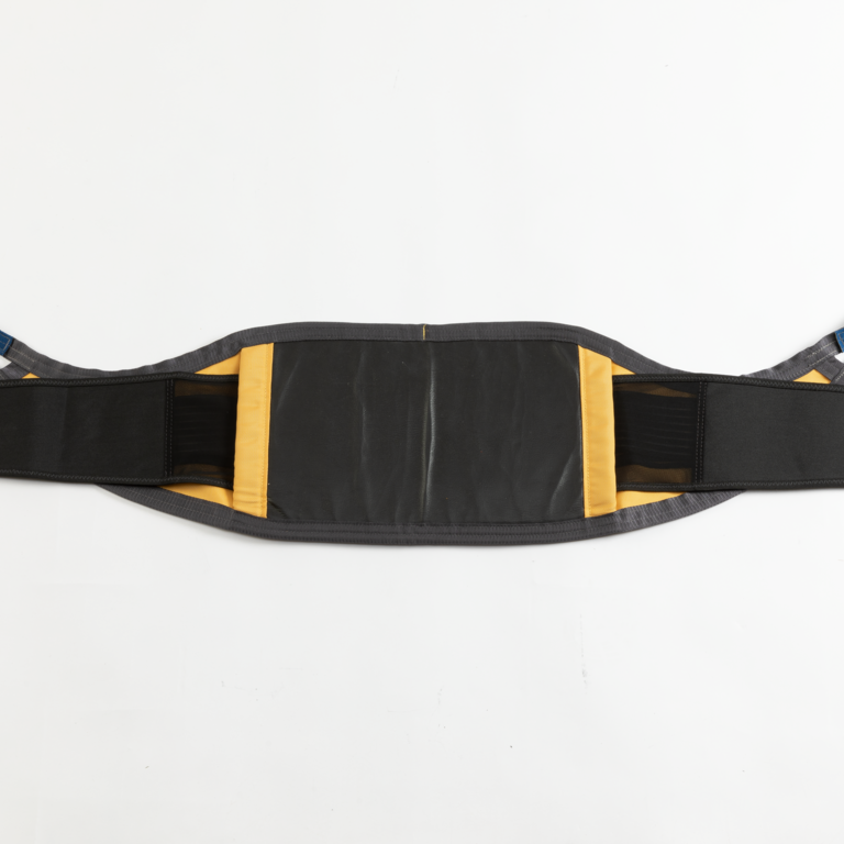 A Guldmann Standing Sling for use with the GLS5.2 Active lifter, designed to provide support during standing and transfers, with an elastic support strap.
